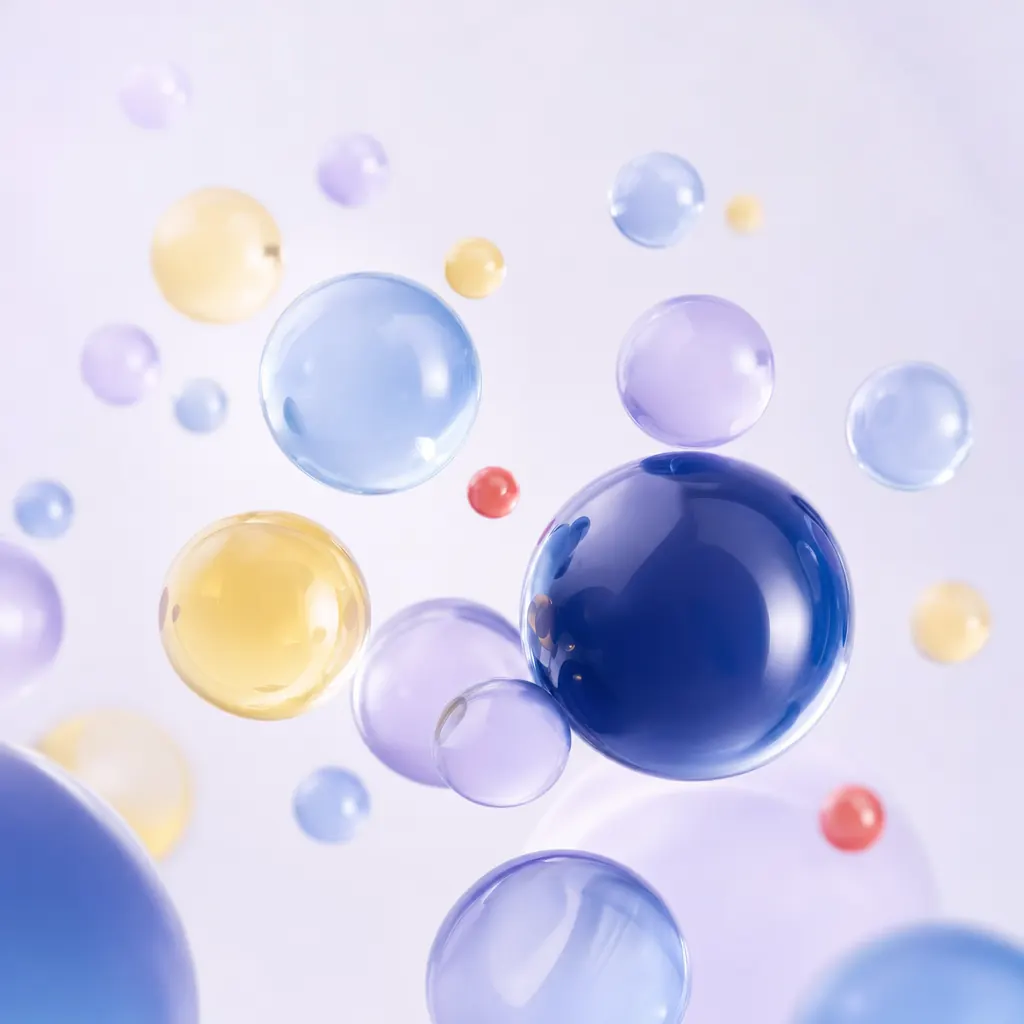 Abstract translucent navy, blue and yellow spheres floating on a light lavender background